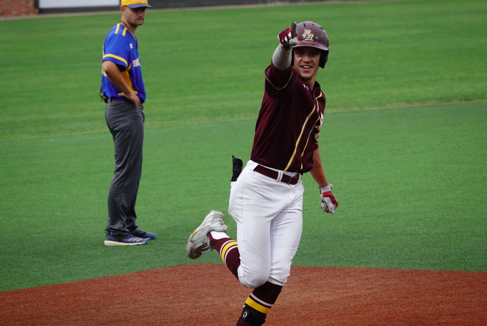 D.K. Donaldson (Gulfport; West Harrison) points to the Wildcat faithful after belting a two-run home run to give Pearl River a 10-8 lead.
