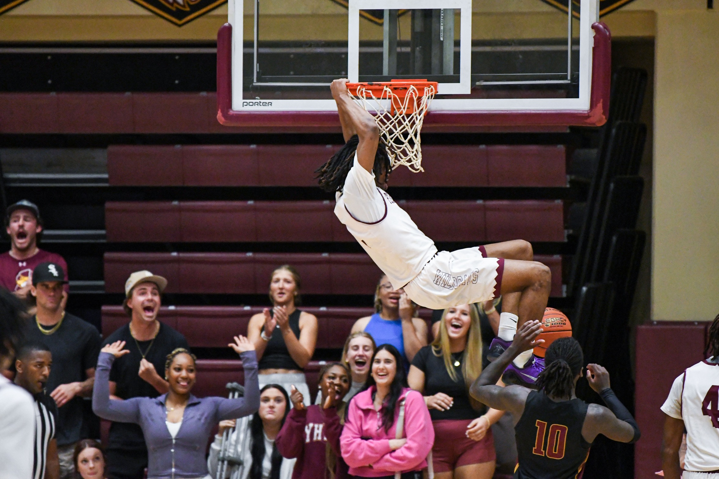 Christian Gilliland throws down an alley-oop slam against rival Jones College (Grace Kesler/PRCC Athletics).