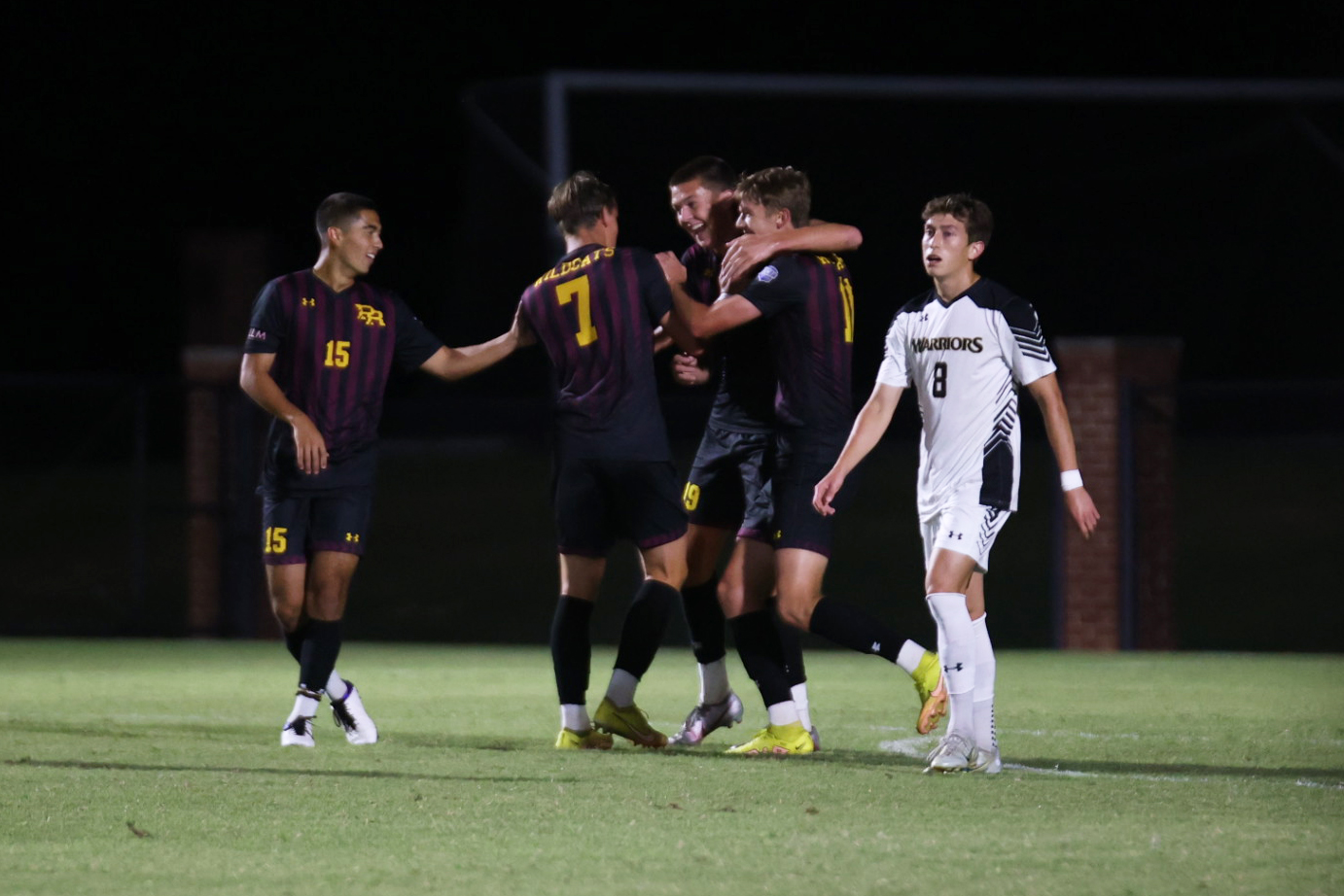 Luke Hopkins (Clinton) celebrates with teammates after picking up a goal against East Central (ECCC Sports Information)