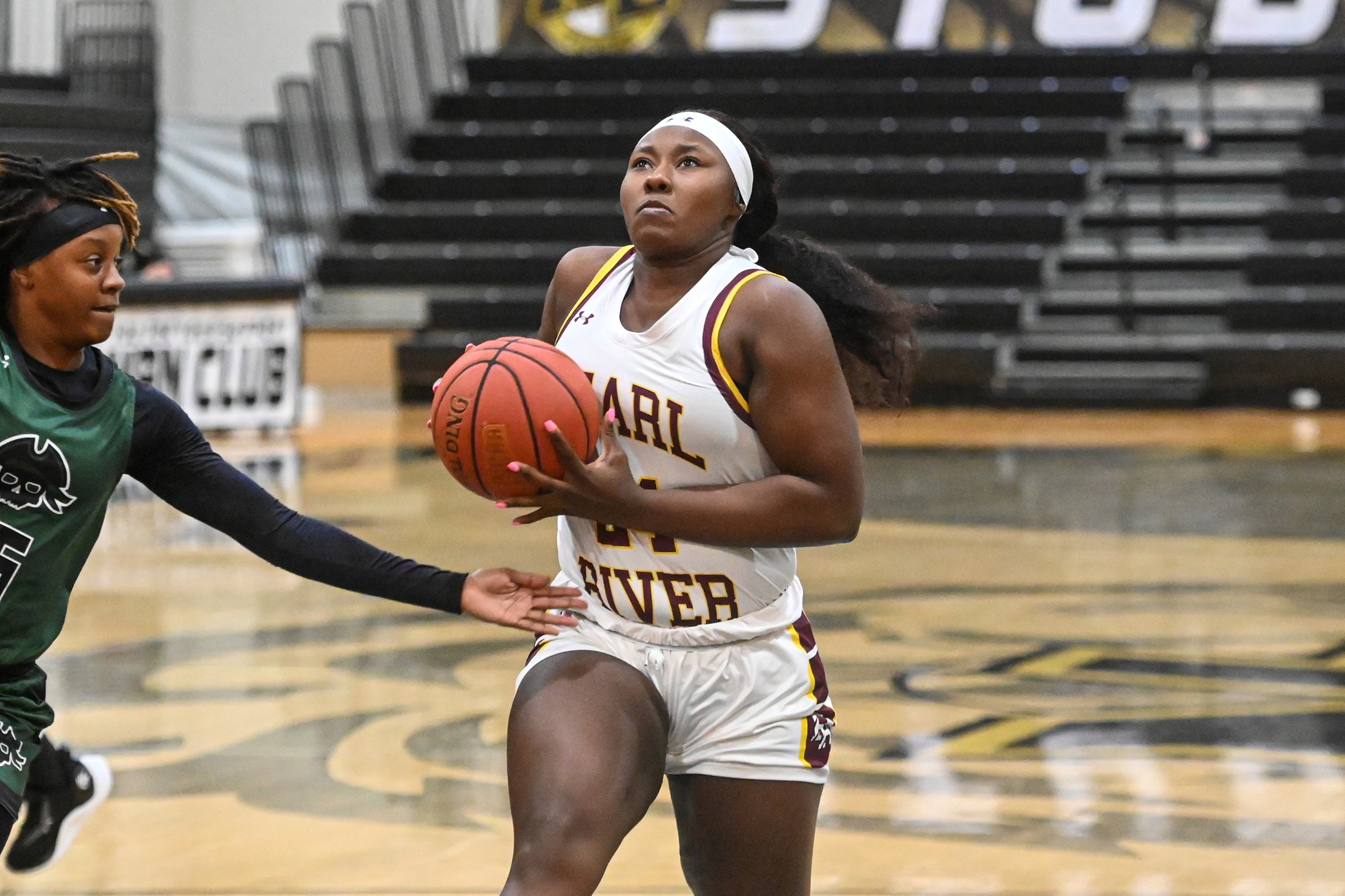 Samya Brooks (Pontotoc) drives to the basket against Shelton State. (Michael H. Miller/NEMCC Public Information)