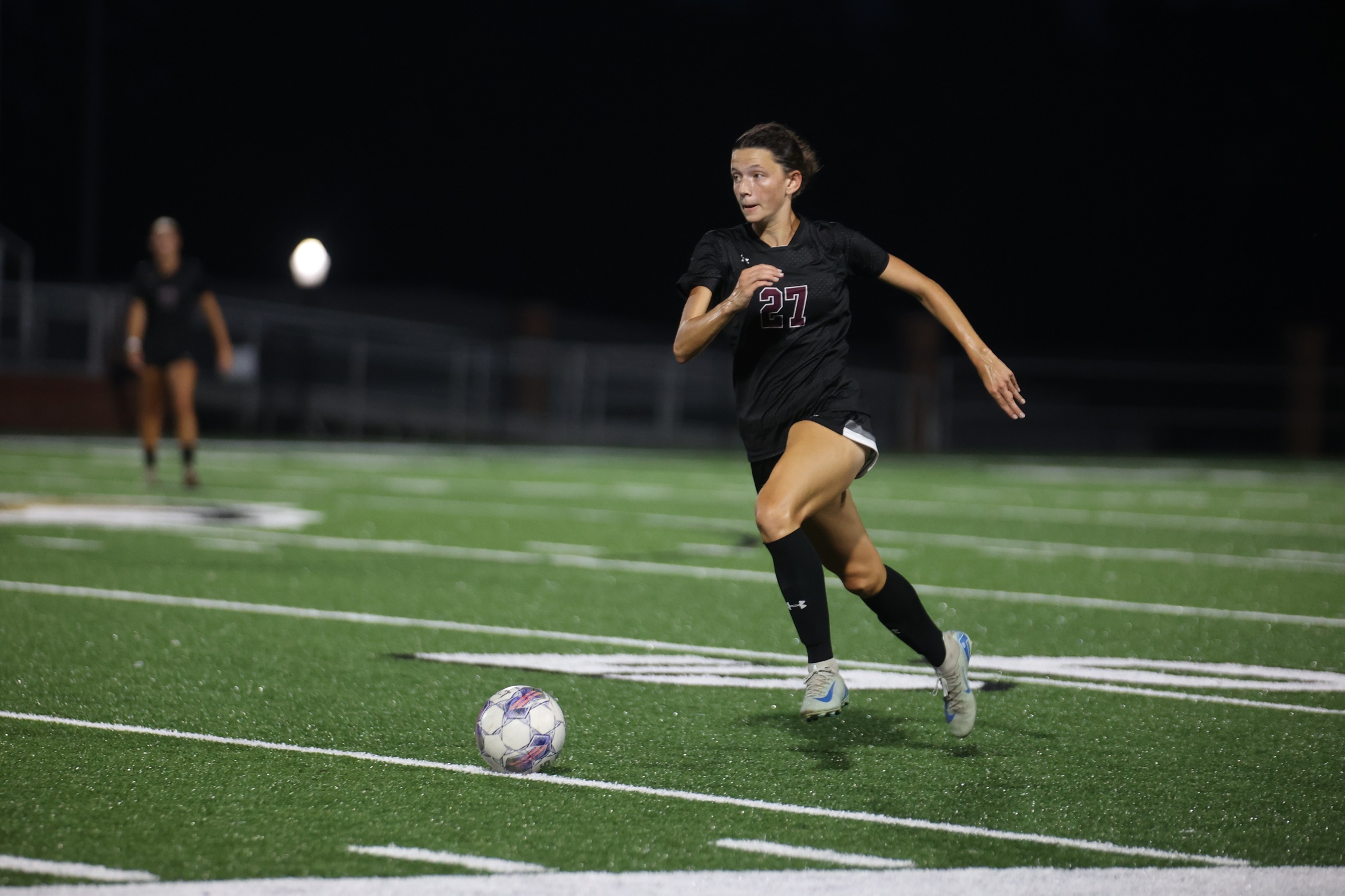 Emily Reinike (Pass Christian; Our Lady Academy) pushes the ball forward against East Central (Landon Rutland/ECCC Athletics).
