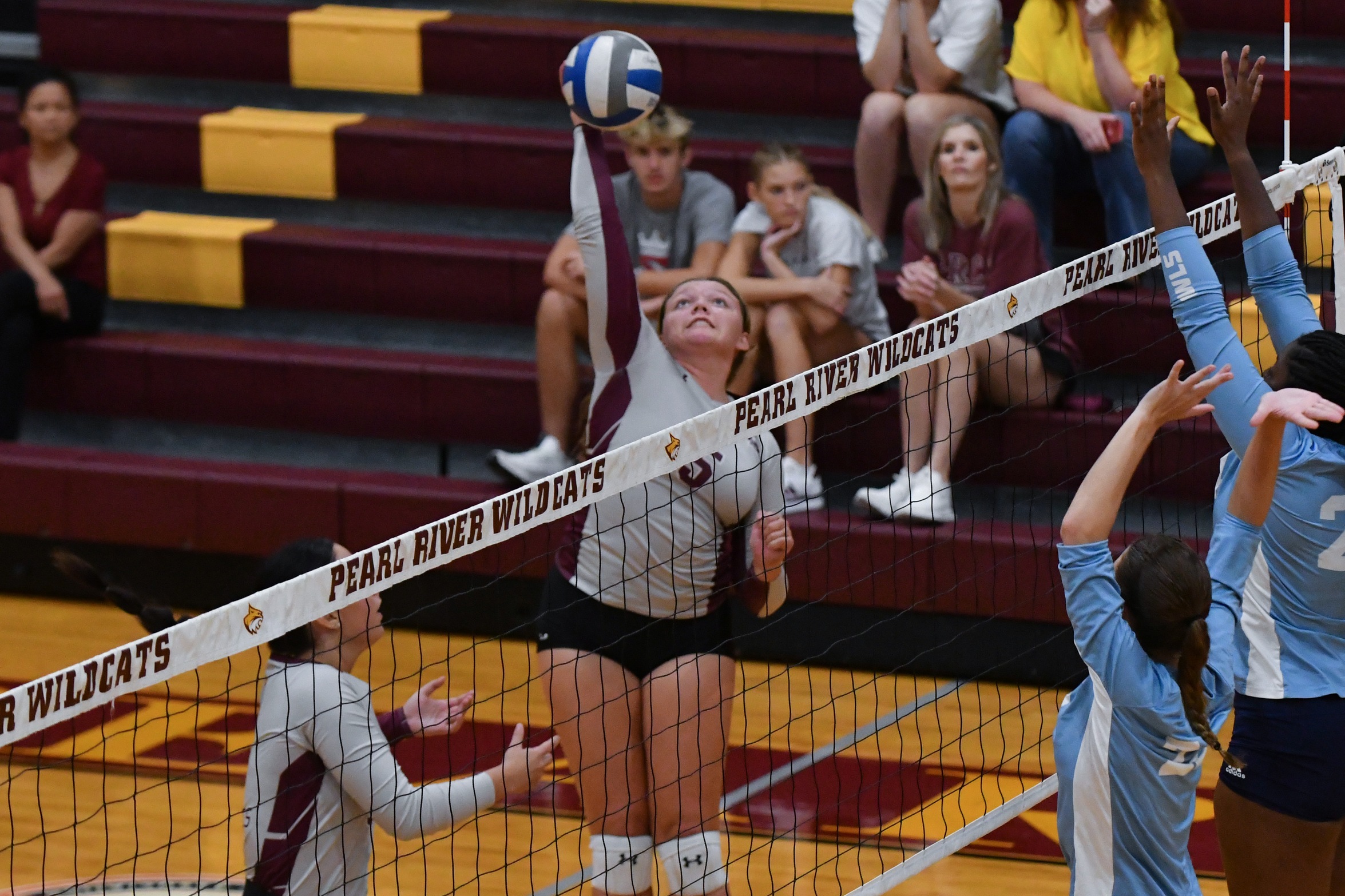 Annalaura Williford (Bay St. Louis; Our Lady Academy) attempts a kill against Mississippi University for Women (Richard Gleber)